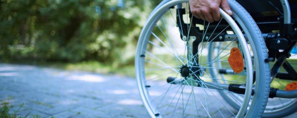 Close up of a wheel of a wheelchair| disability claims denied